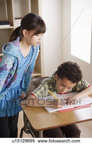 Two children (8-9) at school View Large Photo Image Stock Photography - Two children (8-9) at school. Fotosearch