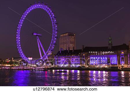 UK, England, London, London eye illuminated at night View Large Photo Image Picture - UK, England, London, London eye illuminated at night. Fotosearch