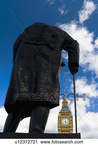 Stock Image - UK, England, London, Winston Churchill statue and Big Ben. Fotosearch