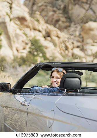 USA, California, Joshua Tree National Park, Young woman driving convertible View Large Photo Image Stock Image - USA, California, Joshua Tree National Park, Young woman driving convertible. Fotosearch