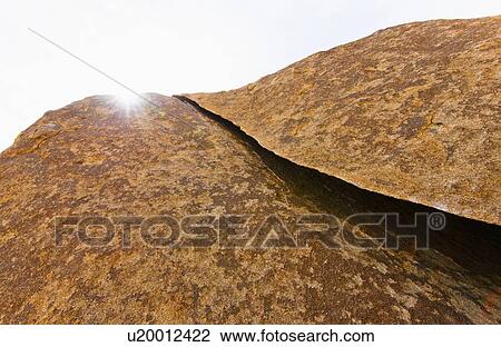 Stock Image - USA, California, Joshua Tree National Park, Sunlit rocks. Fotosearch