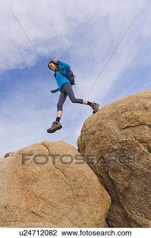 USA, California, Joshua Tree National Park, Female hiker on rocks View Large Photo Image Stock Image - USA, California, Joshua Tree National Park, Female hiker on rocks. Fotosearch