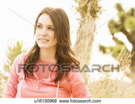 USA, California, Joshua Tree National Park, Portrait of young woman in desert View Large Photo Image Stock Photo - USA, California, Joshua Tree National Park, Portrait of young woman in desert. Fotosearch