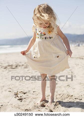 USA, California, Los Angeles, Happy young girl (4-5) playing on beach View Large Photo Image Stock Image - USA, California, Los Angeles, Happy young girl (4-5) playing on beach. Fotosearch