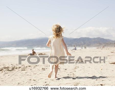 USA, California, Los Angeles, Happy young girl (4-5) running on beach View Large Photo Image Stock Photograph - USA, California, Los Angeles, Happy young girl (4-5) running on beach. Fotosearch