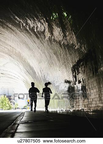 USA, California, Los Angeles, Man and woman running in tunnel View Large Photo Image Stock Photography - USA, California, Los Angeles, Man and woman running in tunnel. Fotosearch