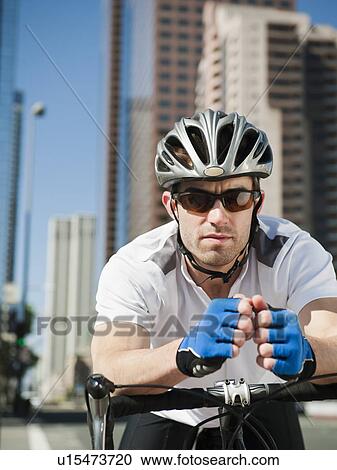 USA, California, Los Angeles, Portrait of young man road cycling on city street View Large Photo Image Stock Image - USA, California, Los Angeles, Portrait of young man road cycling on city street. Fotosearch