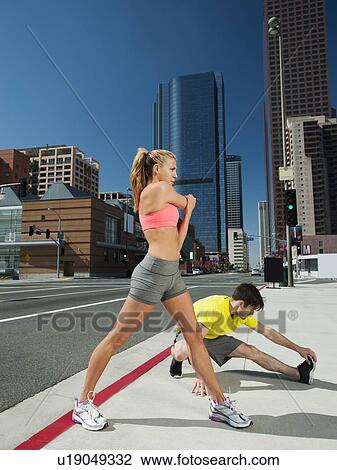 USA, California, Los Angeles, Young man and young woman training on city street View Large Photo Image Stock Image - USA, California, Los Angeles, Young man and young woman training on city street. Fotosearch