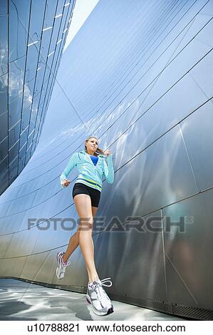 USA, California, Los Angeles, Young woman jogging in city View Large Photo Image Stock Image - USA, California, Los Angeles, Young woman jogging in city. Fotosearch