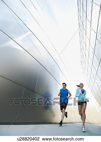USA, California, Los Angeles, Young couple jogging in city View Large Photo Image Stock Image - USA, California, Los Angeles, Young couple jogging in city. Fotosearch