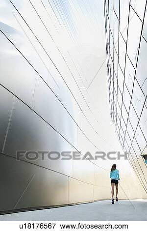 USA, California, Los Angeles, Young woman jogging in city View Large Photo Image Stock Photo - USA, California, Los Angeles, Young woman jogging in city. Fotosearch