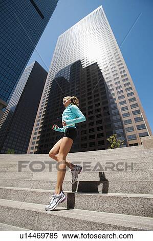 USA, California, Los Angeles, Young woman jogging in city View Large Photo Image Stock Photography - USA, California, Los Angeles, Young woman jogging in city. Fotosearch