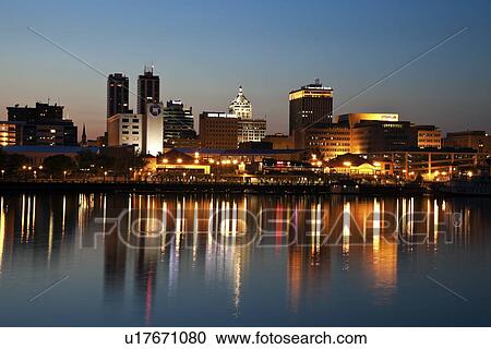 Stock Image - USA, Illinois, Peoria, City view at dusk. Fotosearch