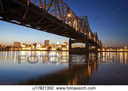 Stock Image - USA, Illinois, Peoria, City view at dusk. Fotosearch