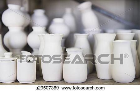 Stock Photo - USA, New Jersey, Jersey City, Pottery on shelves. Fotosearch