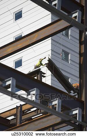 USA, New York, Long Island, New York City, Male workers on construction site View Large Photo Image Stock Image - USA, New York, Long Island, New York City, Male workers on construction site. Fotosearch