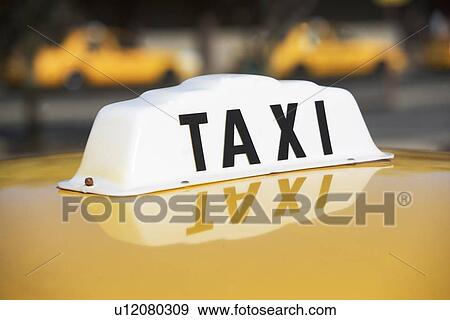 Stock Photo - USA, New York, Long Island, New York City, Close up of taxi sign. Fotosearch
