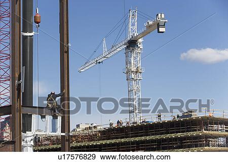 Stock Photo - USA, New York, Long Island, New York City, Male worker on construction site. Fotosearch