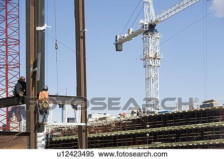 USA, New York, Long Island, New York City, Male workers on construction site View Large Photo Image Stock Photography - USA, New York, Long Island, New York City, Male workers on construction site. Fotosearch