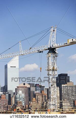 USA, New York, New York City, Manhattan, Skyline with crane View Large Photo Image Stock Image - USA, New York, New York City, Manhattan, Skyline with crane. Fotosearch