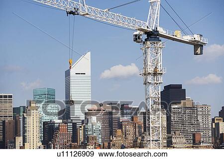 USA, New York, New York City, Manhattan, Skyline with crane View Large Photo Image Stock Photo - USA, New York, New York City, Manhattan, Skyline with crane. Fotosearch
