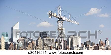 USA, New York, New York City, Manhattan, Skyline with crane View Large Photo Image Stock Photography - USA, New York, New York City, Manhattan, Skyline with crane. Fotosearch