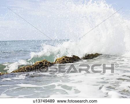 USA, Puerto Rico, Ricon, Surf splashing on rocks View Large Photo Image Stock Photo - USA, Puerto Rico, Ricon, Surf splashing on rocks. Fotosearch
