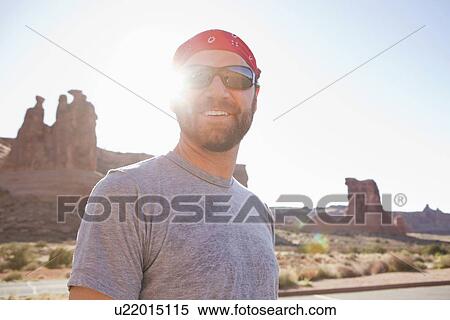 USA, Utah, Moab, Mid adult man posing in cycling gear View Large Photo Image Stock Photography - USA, Utah, Moab, Mid adult man posing in cycling gear. Fotosearch