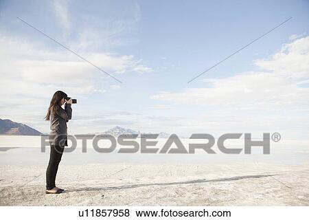 USA, Utah, Salt Lake City, Young woman taking photos View Large Photo Image Stock Photo - USA, Utah, Salt Lake City, Young woman taking photos. Fotosearch