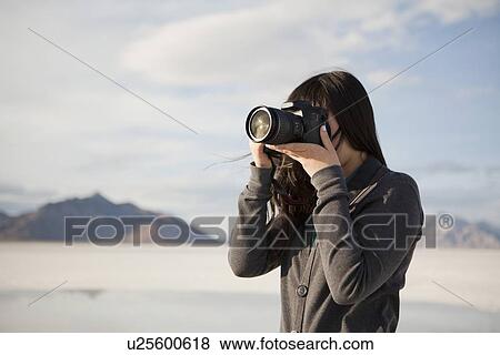 USA, Utah, Salt Lake City, Young woman taking photos View Large Photo Image Stock Photo - USA, Utah, Salt Lake City, Young woman taking photos. Fotosearch