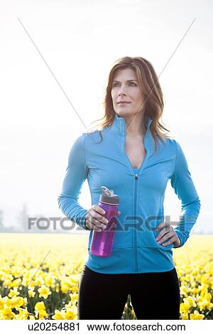USA, Washington, Skagit Valley, Portrait of woman in blue tracksuit View Large Photo Image Stock Image - USA, Washington, Skagit Valley, Portrait of woman in blue tracksuit. Fotosearch