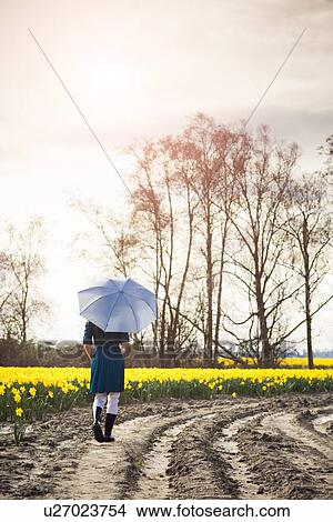 USA, Washington, Skagit Valley, Woman with umbrella on country road View Large Photo Image Picture - USA, Washington, Skagit Valley, Woman with umbrella on country road. Fotosearch