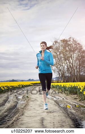 USA, Washington, Skagit Valley, Woman running in rural area View Large Photo Image Stock Photo - USA, Washington, Skagit Valley, Woman running in rural area. Fotosearch