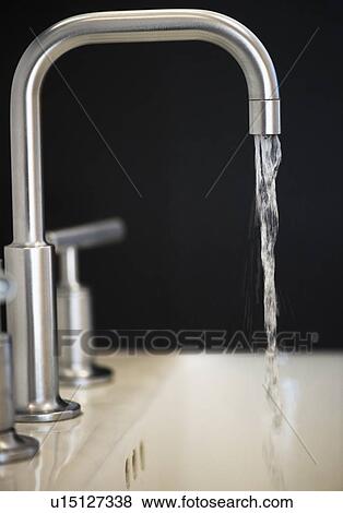 Stock Photo - Water flowing from faucet. Fotosearch
