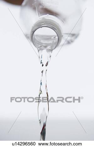 Stock Image - Water pouring from bottle. Fotosearch