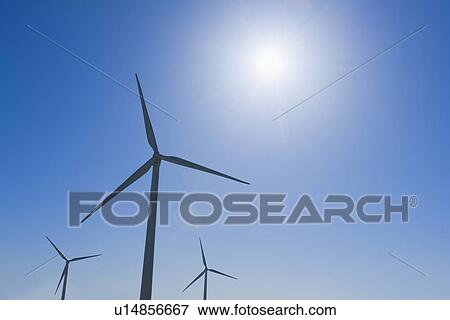 Wind turbine against blue sky View Large Photo Image Stock Photo - Wind turbine against blue sky. Fotosearch