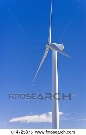 Stock Photography - Wind turbine against blue sky. Fotosearch