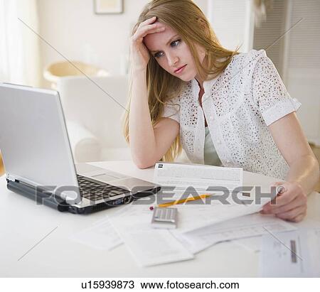 Woman doing paperwork View Large Photo Image Stock Image - Woman doing paperwork. Fotosearch