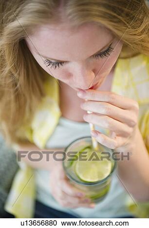 Woman drinking water View Large Photo Image Stock Image - Woman drinking water. Fotosearch