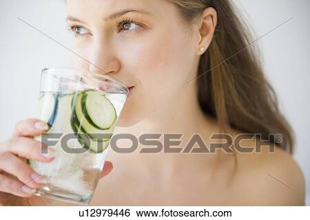 Woman drinking water View Large Photo Image Stock Photograph - Woman drinking water. Fotosearch