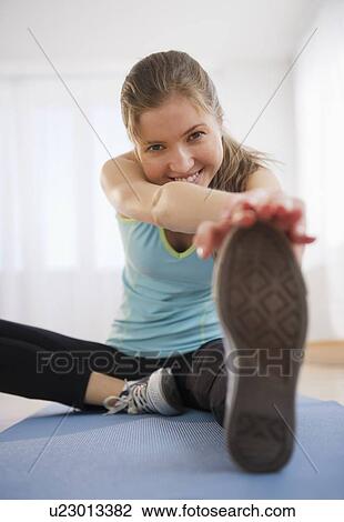 Woman exercising View Large Photo Image Stock Image - Woman exercising. Fotosearch