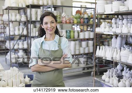 Woman in pottery warehouse View Large Photo Image Stock Photo - Woman in pottery warehouse. Fotosearch