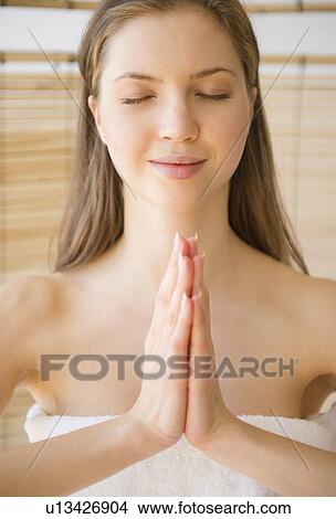 Woman meditating in spa View Large Photo Image Picture - Woman meditating in spa. Fotosearch