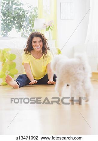 Woman playing with her dog View Large Photo Image Stock Image - Woman playing with her dog. Fotosearch