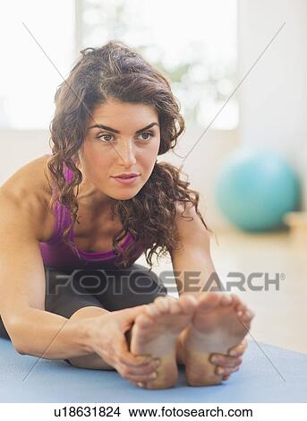 Picture - Woman practicing yoga. Fotosearch