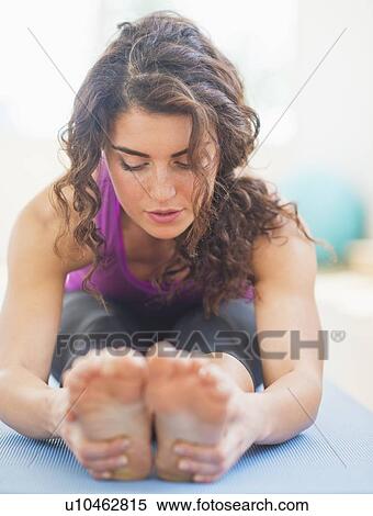 Woman practicing yoga View Large Photo Image Stock Photography - Woman practicing yoga. Fotosearch