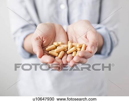 Woman showing medicine pills View Large Photo Image Stock Image - Woman showing medicine pills. Fotosearch
