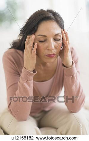 Woman sitting with head in hands View Large Photo Image Stock Image - Woman sitting with head in hands. Fotosearch