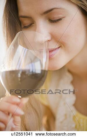 Woman smelling wine View Large Photo Image Stock Image - Woman smelling wine. Fotosearch