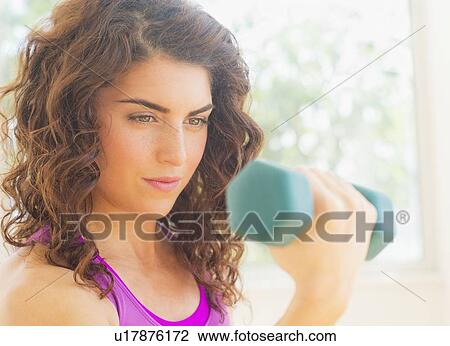 Woman weight lifting View Large Photo Image Stock Image - Woman weight lifting. Fotosearch